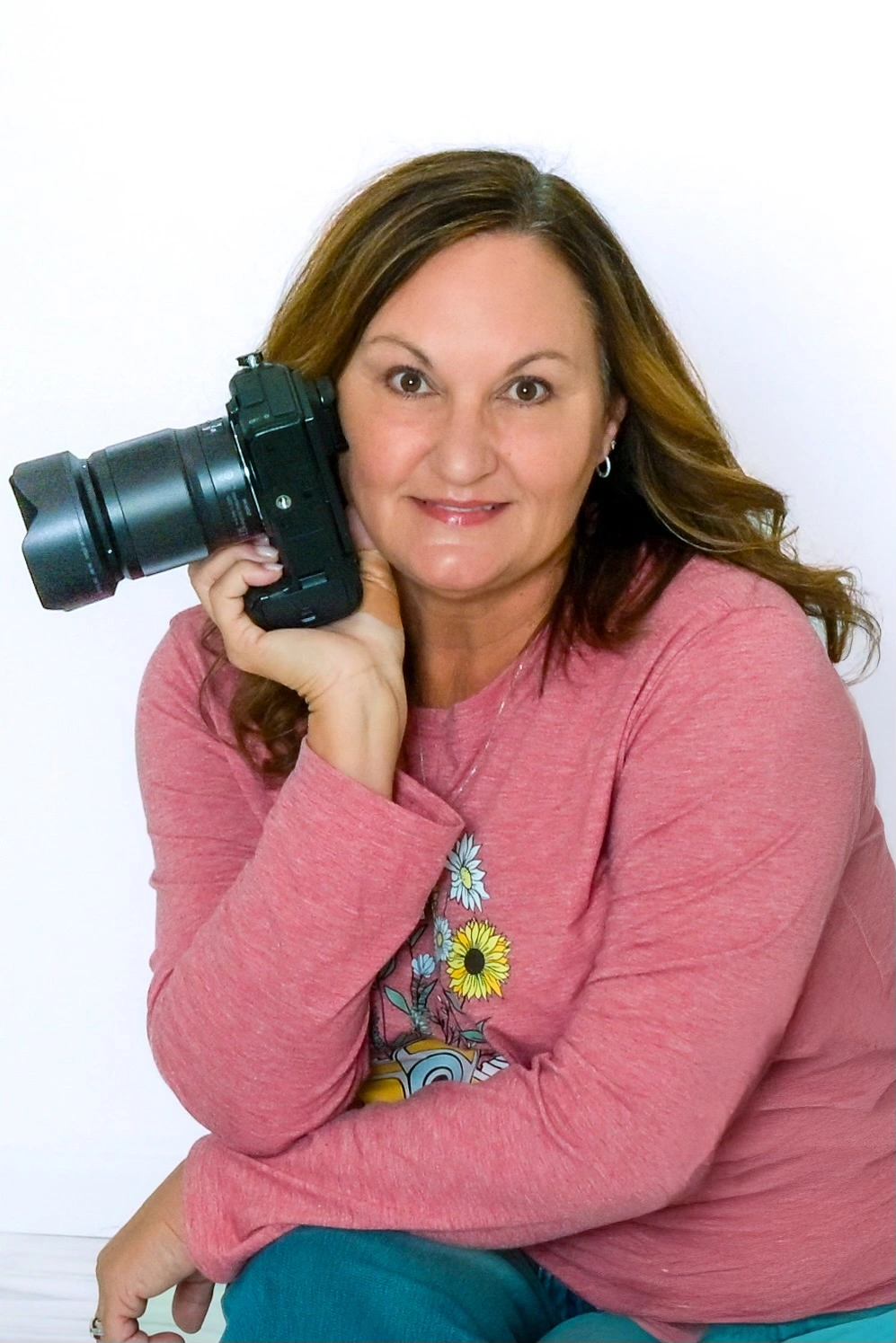 Carla Funk holding her camera